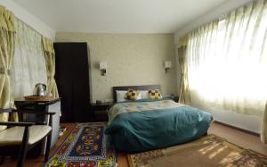 Llit o llits en una habitació de Nirvana Home