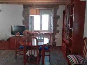 Televízia a/alebo spoločenská miestnosť v ubytovaní La Casa de Santa Olalla
