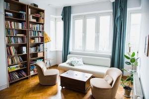 a living room with a couch and two chairs at Tenement Apartment 90m2 City Center in Krakow