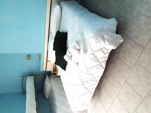 Postel nebo postele na pokoji v ubytování Hotel Giannella