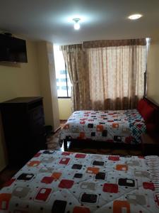 Postel nebo postele na pokoji v ubytování Hotel Navarra