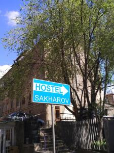 a street sign in front of a house at Hostel Sakharov & Tours in Yerevan