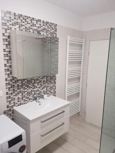 a white bathroom with a sink and a mirror at App Sandra 3 bedrooms on 112m2 Kostrena in Šodići +62 photos