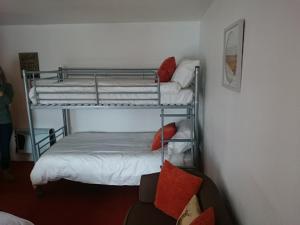 a bedroom with two bunk beds in a room at The Castle Hotel in Portmahomack