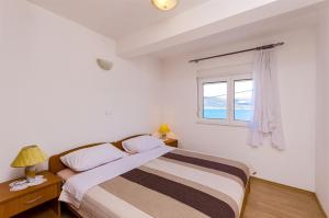 Posteľ alebo postele v izbe v ubytovaní Apartments Krusica