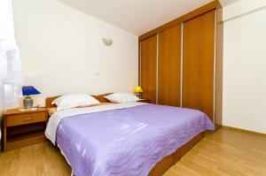 Posteľ alebo postele v izbe v ubytovaní Apartments Krusica