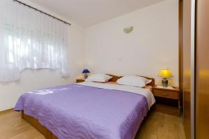 Posteľ alebo postele v izbe v ubytovaní Apartments Krusica