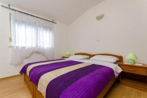 Posteľ alebo postele v izbe v ubytovaní Apartments Krusica