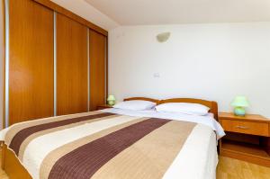 Posteľ alebo postele v izbe v ubytovaní Apartments Krusica