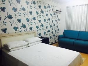 Ліжко або ліжка в номері Hotel do Lago