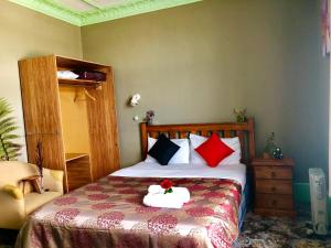 Voodi või voodid majutusasutuse Harbourview Stadium Hotel toas