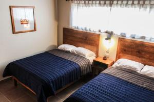 Postel nebo postele na pokoji v ubytování Hotel María del Tío Molcas