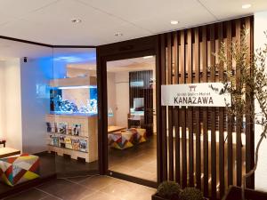a store front with a sign on the door at Kanazawa Station Hotel in Kanazawa