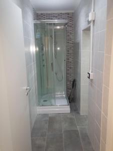 a shower with a glass door in a bathroom at B&B da Bibi in Fabriano