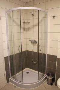 a shower with a glass enclosure in a bathroom at Istrian Sunrise in Koper