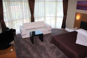 A bed or beds in a room at City Hotel Plovdiv