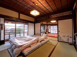 Postel nebo postele na pokoji v ubytování Masuya Ryokan + 37 fotografií