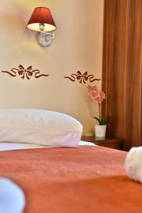 Postel nebo postele na pokoji v ubytování Guesthouse Corali