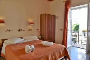 Postel nebo postele na pokoji v ubytování Guesthouse Corali