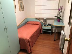 Postel nebo postele na pokoji v ubytování Hotel Pelayo