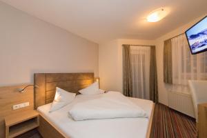 Posteľ alebo postele v izbe v ubytovaní ARBOR Hotel & Apartments