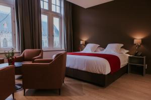 Ένα ή περισσότερα κρεβάτια σε δωμάτιο στο Hotel New Regina