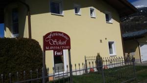 a yellow building with a sign in front of it at Ferienhaus Scharl in Schruns