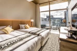 מיטה או מיטות בחדר ב-Hotel Musse Ginza Meitetsu