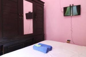 Postel nebo postele na pokoji v ubytování Anantaya Home Denpasar