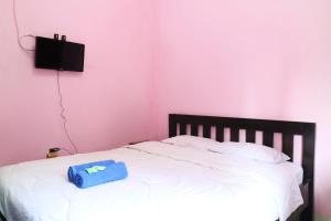 Postel nebo postele na pokoji v ubytování Anantaya Home Denpasar + 17 fotografií