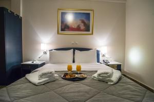 Postel nebo postele na pokoji v ubytování Anita Hotel
