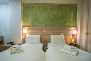 Postel nebo postele na pokoji v ubytování Anita Hotel