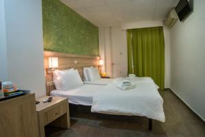 Postel nebo postele na pokoji v ubytování Anita Hotel