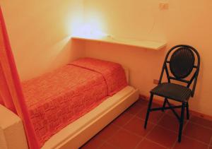 Postel nebo postele na pokoji v ubytování Tanca Manna Grimaldi