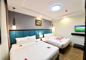 Giường trong phòng chung tại Bella Rosa Trendy Hotel & Spa