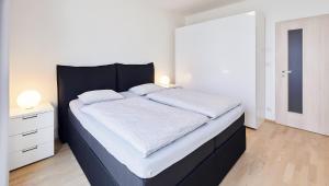 Posteľ alebo postele v izbe v ubytovaní Garden Towers Apartments