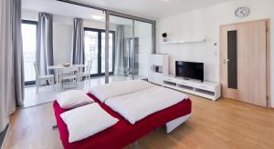 Postel nebo postele na pokoji v ubytování Garden Towers Apartments