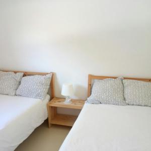 Postel nebo postele na pokoji v ubytování Camping Playa Sauces