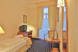 Posteľ alebo postele v izbe v ubytovaní Belvedere Wellness Hotel
