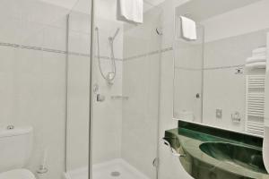Kúpeľňa v ubytovaní Belvedere Wellness Hotel