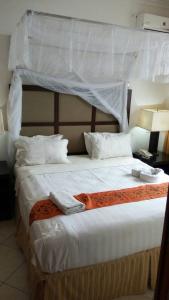 En eller flere senger på et rom på ShaMooL Hotel