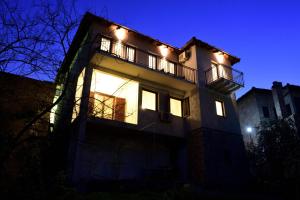 a building with lights on it at night at Pansion Villa Nur in Mostar