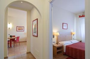 Ένα ή περισσότερα κρεβάτια σε δωμάτιο στο Residence I Triangoli