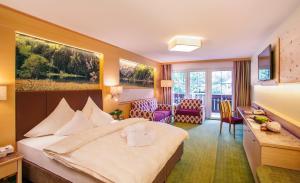 Postel nebo postele na pokoji v ubytování Hotel Sägerhof