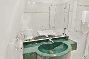 Kúpeľňa v ubytovaní Belvedere Wellness Hotel