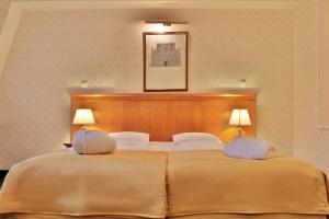 Posteľ alebo postele v izbe v ubytovaní Belvedere Wellness Hotel