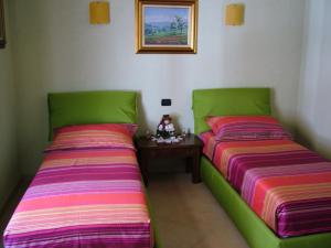 Een bed of bedden in een kamer bij Il Grappolo Vacanze