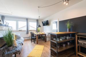 a living room with a couch and a table at Romantische Wohnung in Bad Wörishofen in Bad Wörishofen