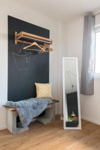 a mirror in a room with a bed and a mirror at Romantische Wohnung in Bad Wörishofen in Bad Wörishofen