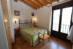 Postel nebo postele na pokoji v ubytování Casa Rural el Huerto